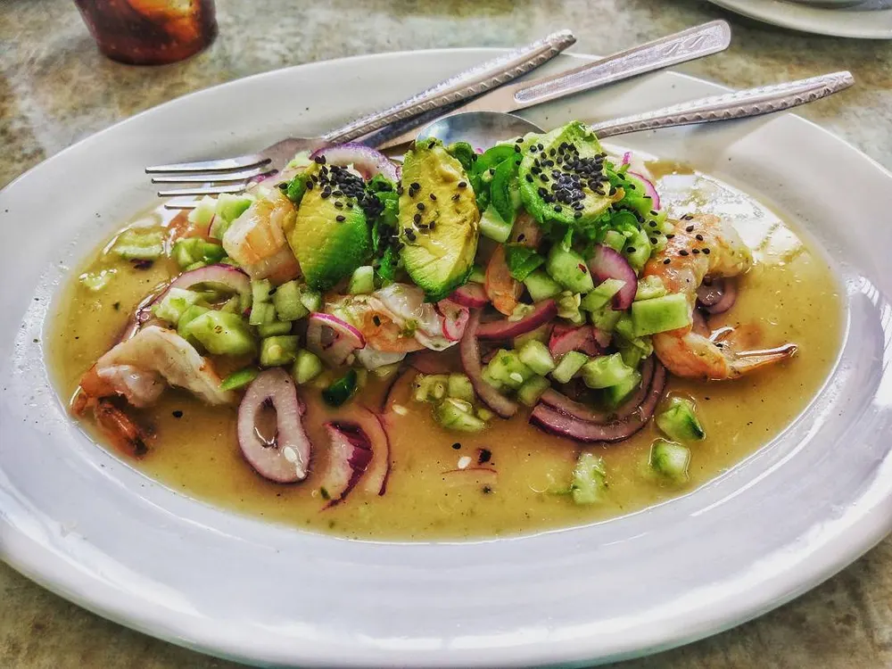 Aguachile verde — raw shrimp cured in lime with cucumber, onion and green chili