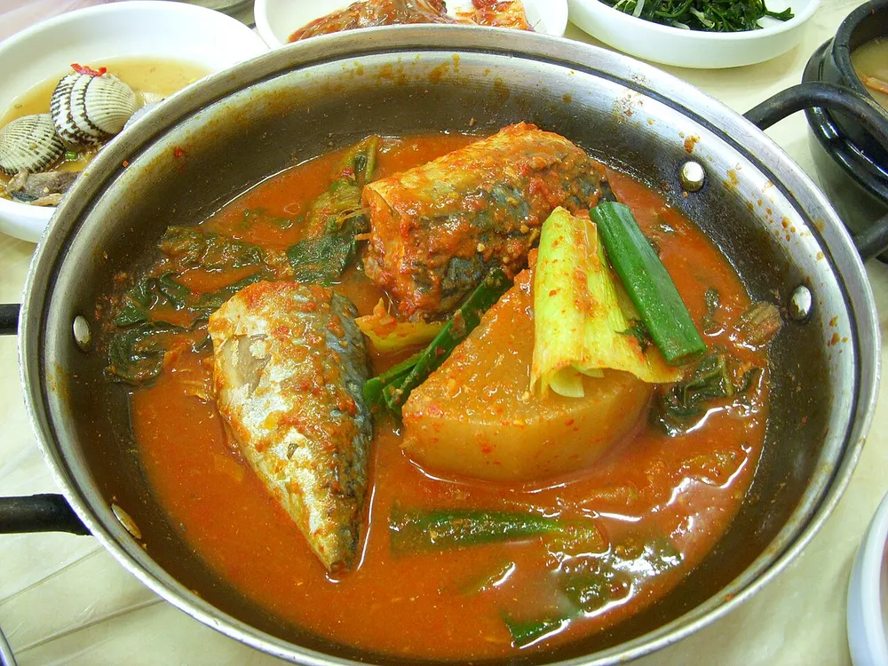 Godeungeo-jorim — mackerel braised in a spicy sauce with radish and greens