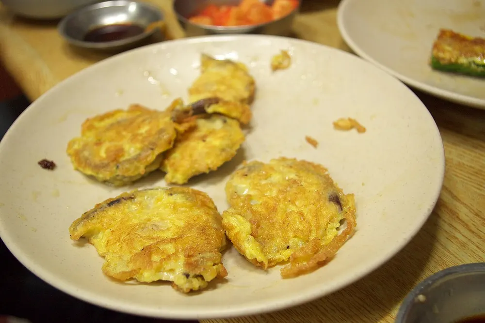 Beoseot-jeon — mushrooms coated in egg batter and pan-fried