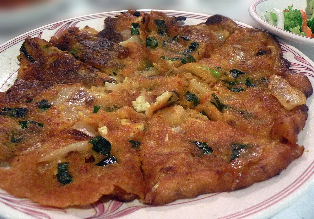 Kimchi jijimi — a crisp-edged Korean kimchi pancake