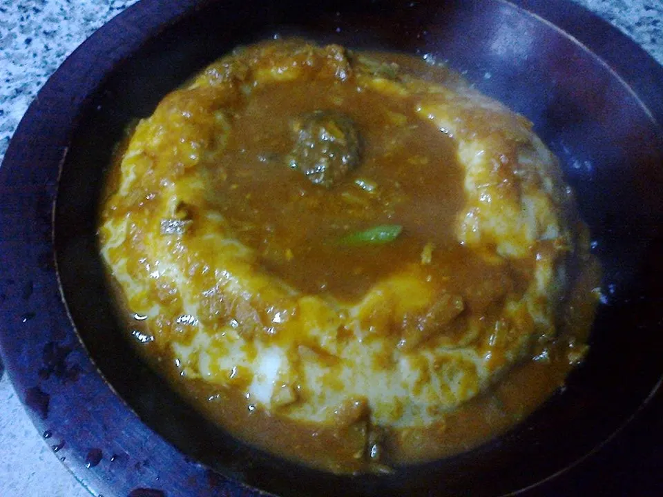 Asida โ smooth wheat porridge topped with ghee