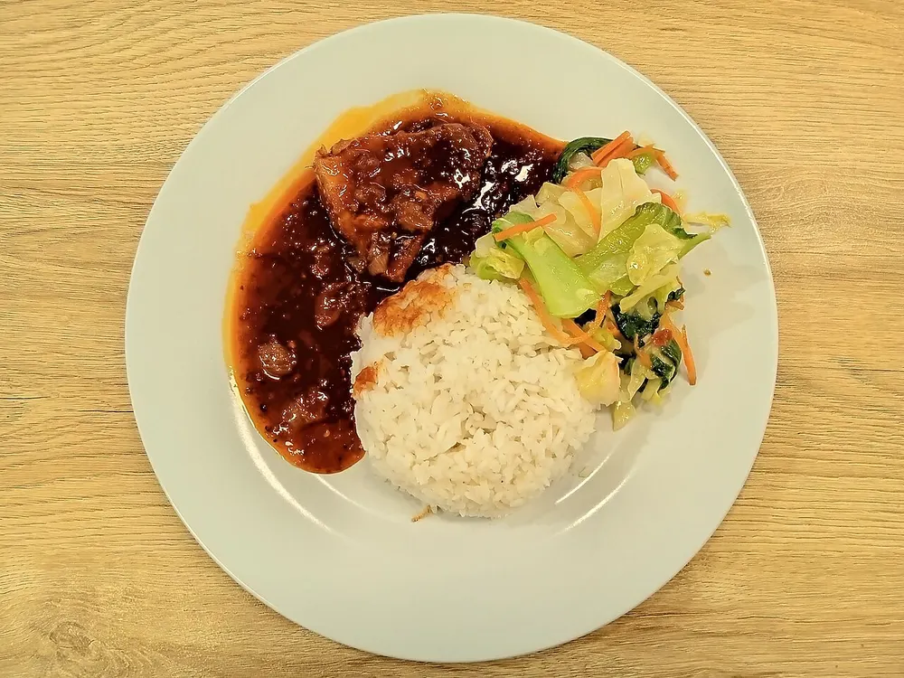 Ayam masak merah — chicken in a spicy tomato-chili sauce, with rice