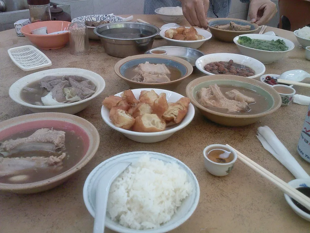 Bak kut teh — pork ribs simmered in a peppery herbal broth, with youtiao and rice