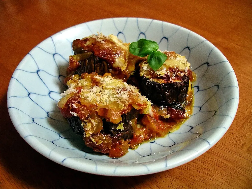 Parmigiana di melanzane — baked layers of aubergine, tomato and cheese