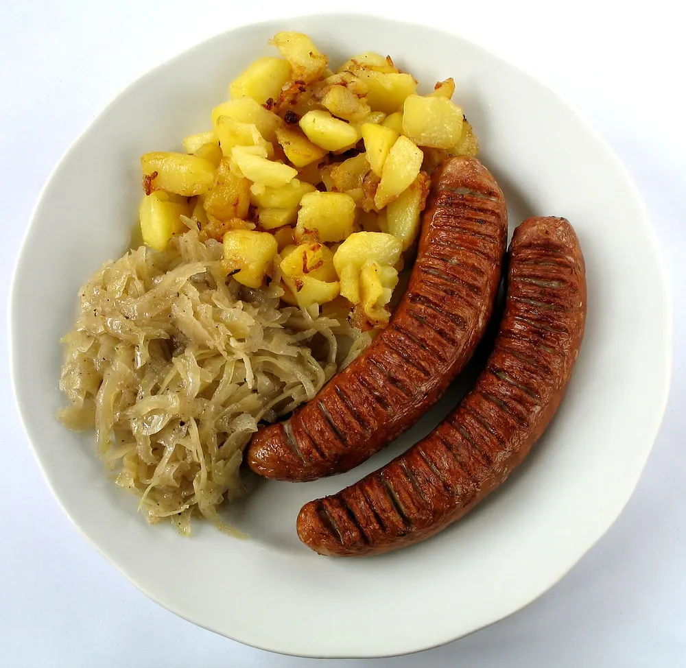 Bratwurst with sauerkraut and fried potatoes