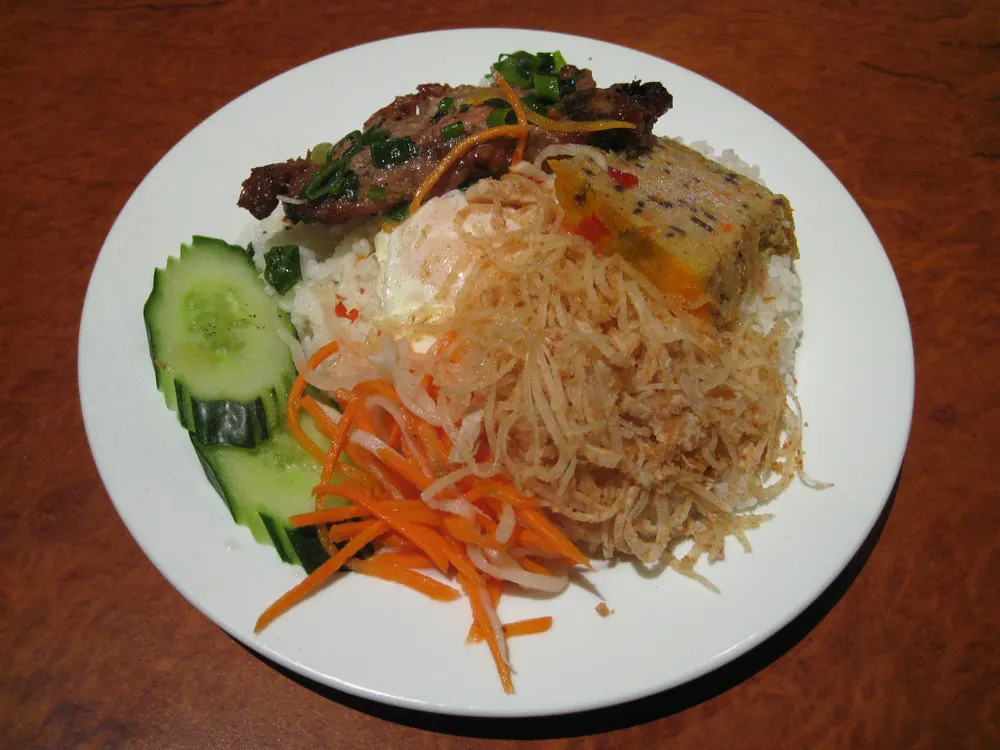 Cơm tấm — broken rice with grilled pork chop, shredded pork skin and egg cake