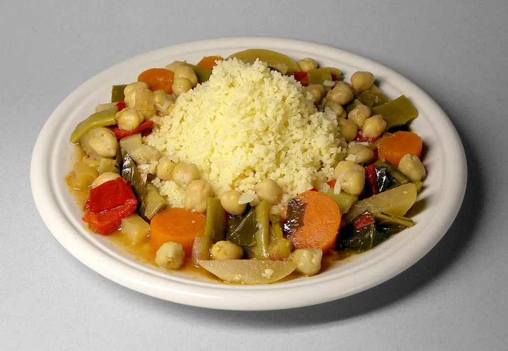 Couscous with seven vegetables — steamed semolina mounded with a vegetable stew