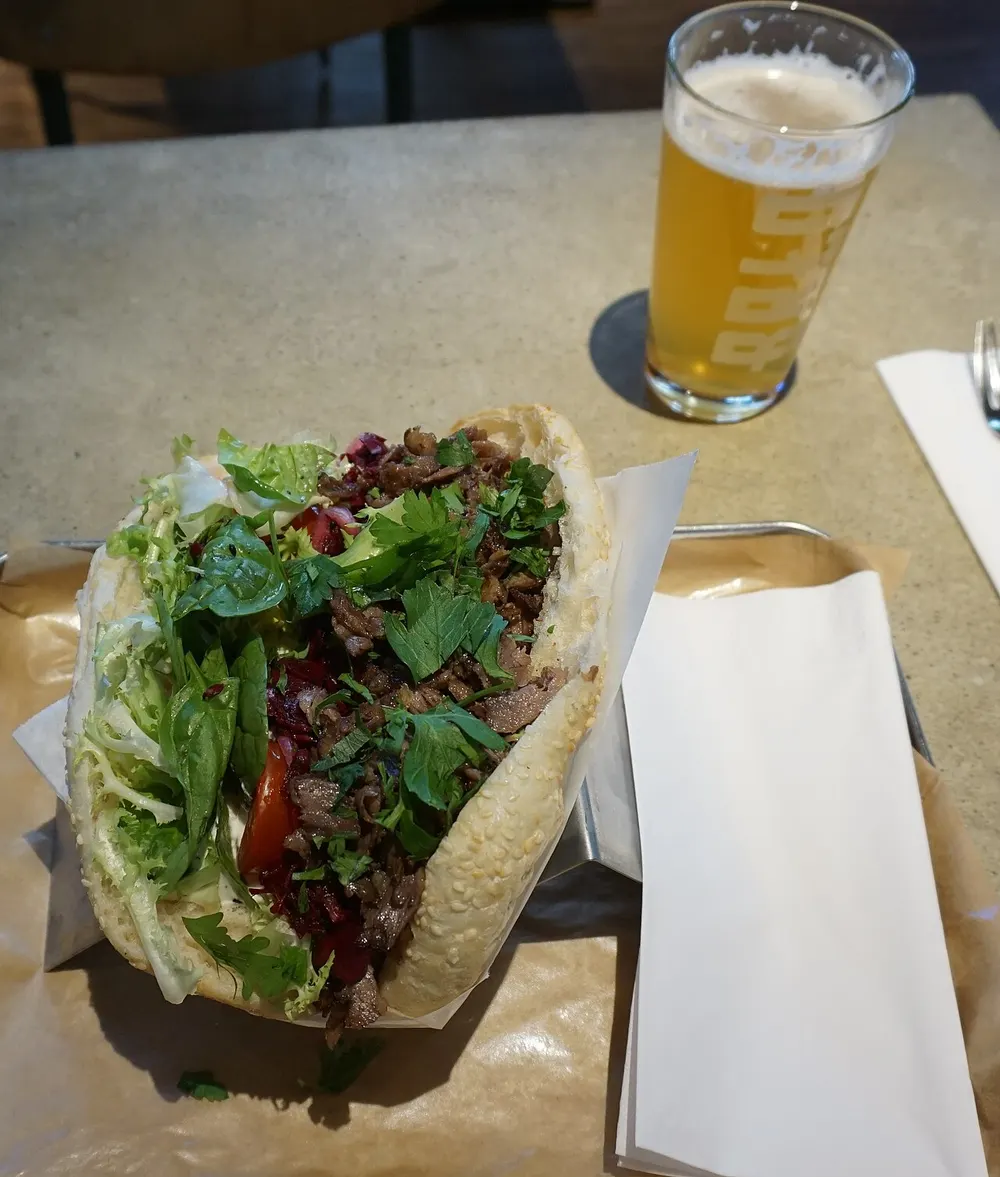 Berlin-style döner kebab — spiced meat, salad and garlic-yogurt sauce in flatbread