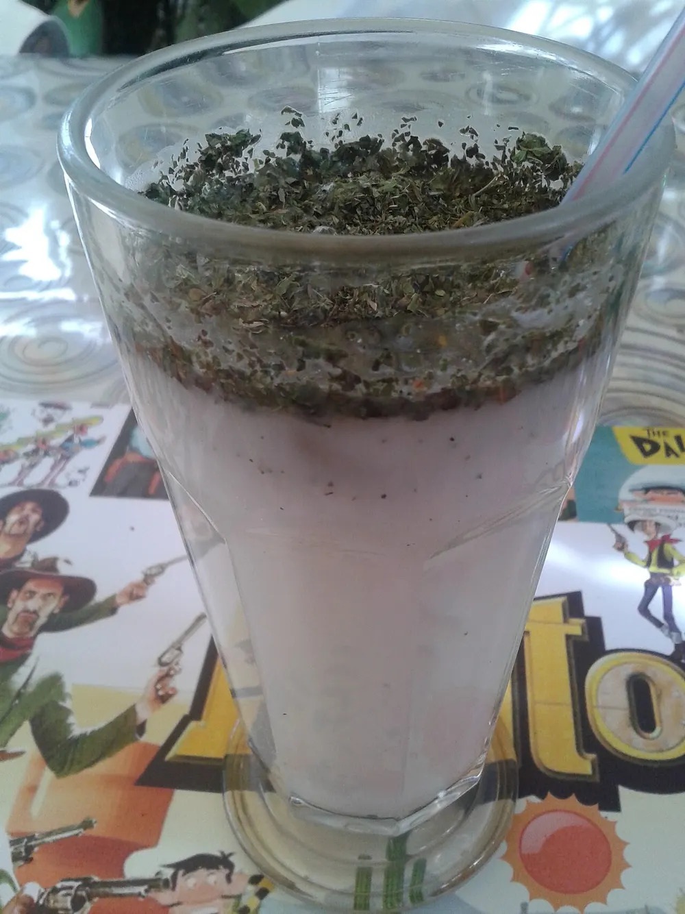 Doogh — chilled savoury yogurt drink topped with dried mint