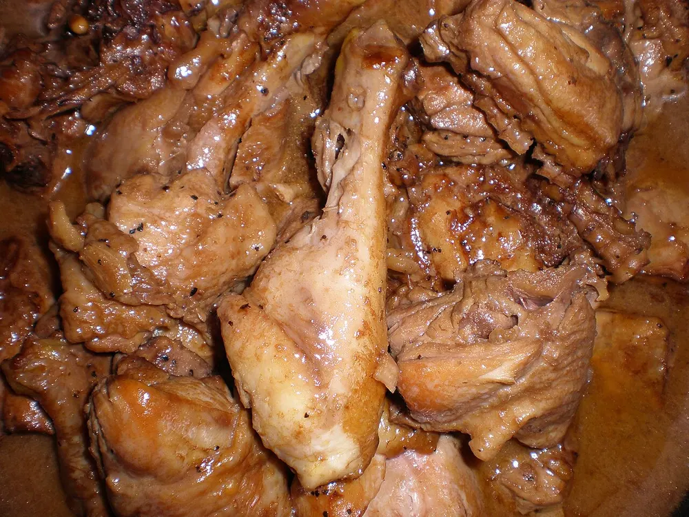 Chicken adobo — chicken braised in soy sauce, vinegar, garlic and pepper