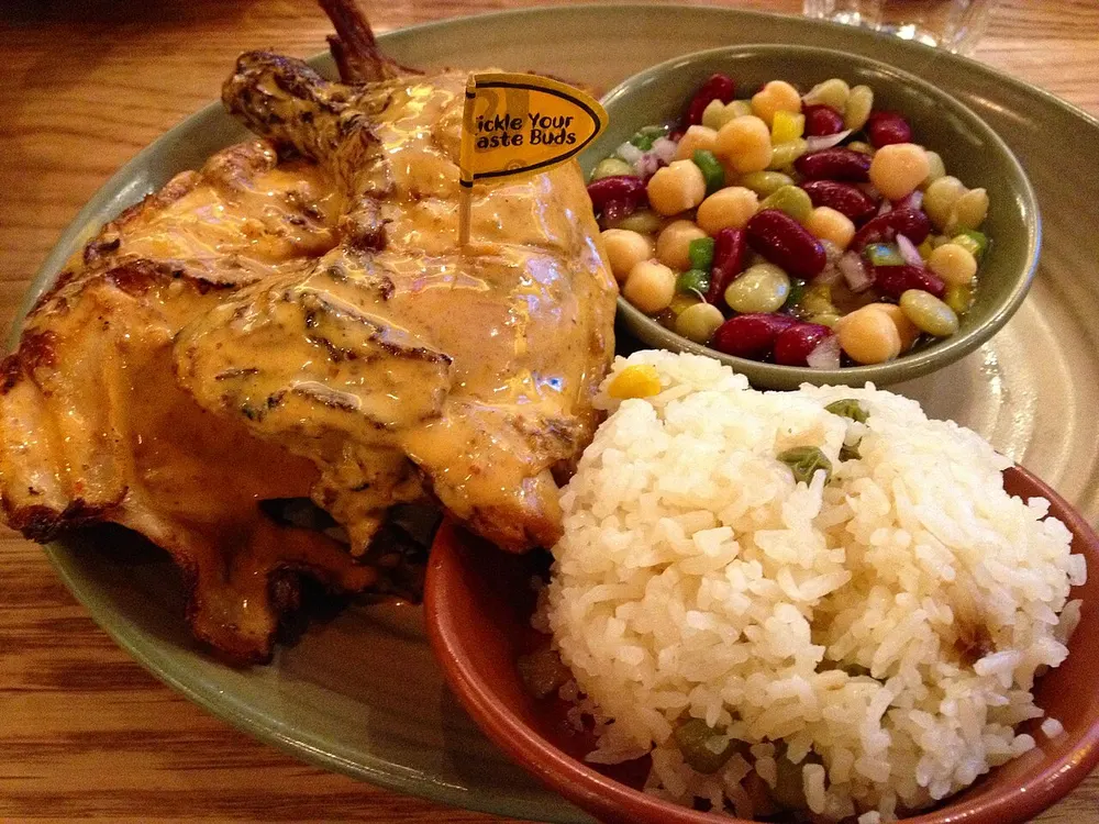 Frango piri-piri — flame-grilled chicken in spicy peri-peri sauce