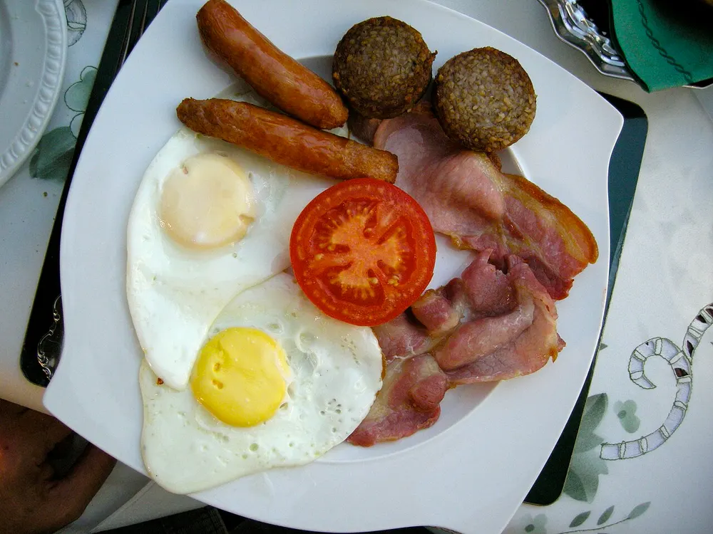 A full Irish breakfast — two fried eggs, sausages, rashers, black pudding and a grilled tomato