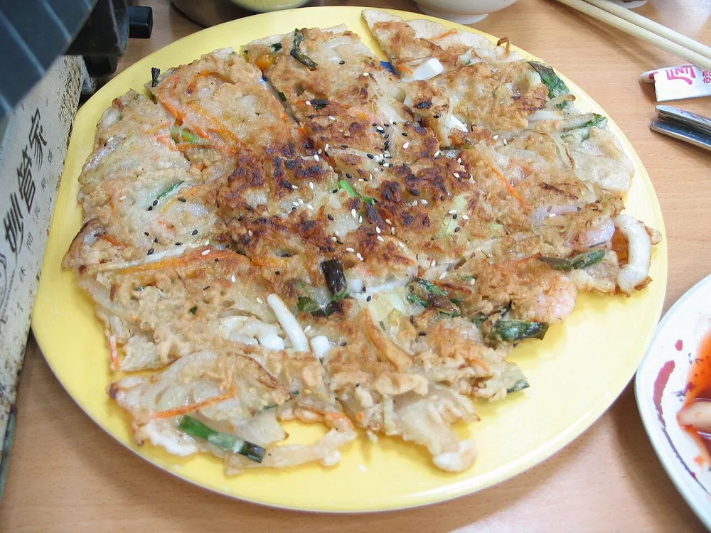 A seafood scallion pancake cut into pieces