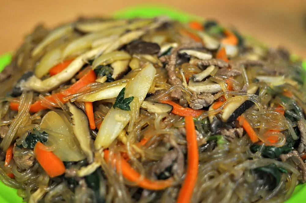 Japchae — sweet-potato glass noodles tossed with beef and vegetables
