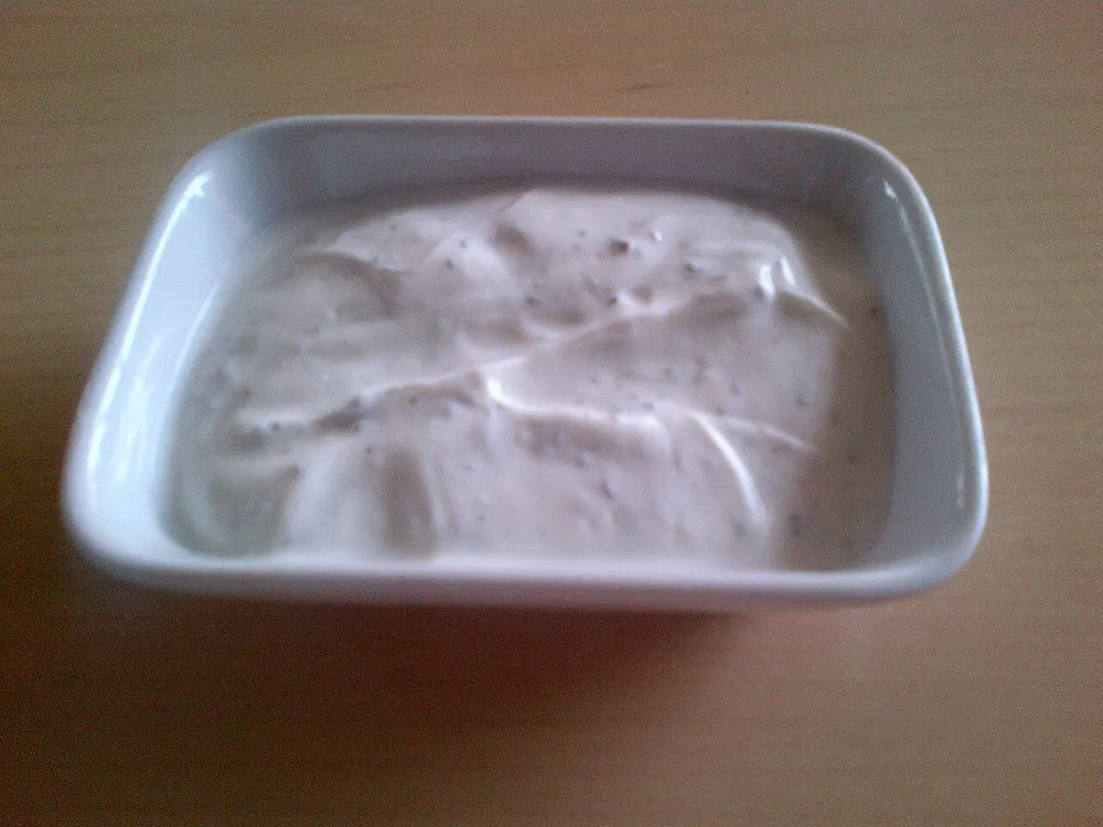 A bowl of thick strained-yogurt haydari dip with herbs