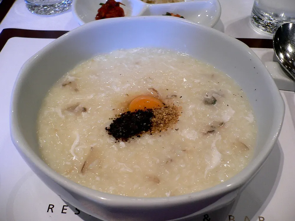 Gyeran-juk — Korean rice porridge topped with an egg yolk and pepper