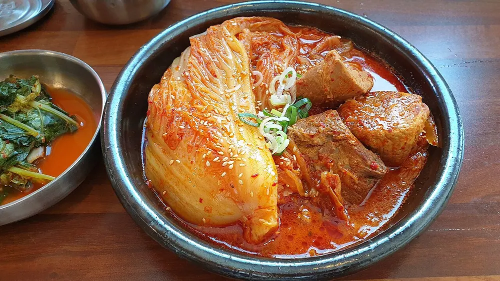 Kimchi-jjim — a whole kimchi head braised with pork until soft