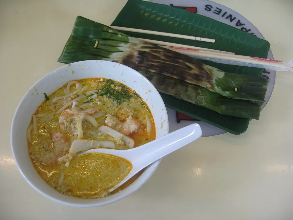Katong laksa — coconut curry laksa with short-cut noodles, prawns and cockles