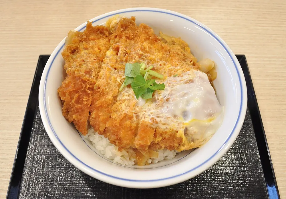A bowl of katsudon — egg-topped pork cutlet over rice