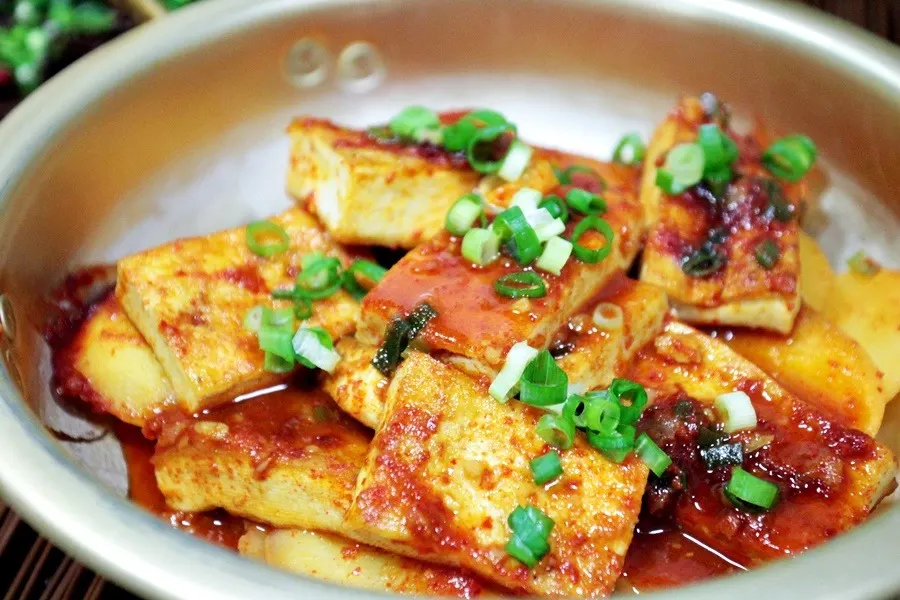 Slabs of tofu braised in a red soy-and-chili sauce