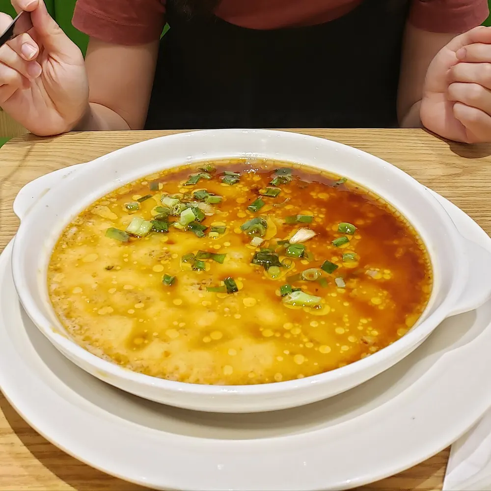 Cantonese steamed eggs — silky savoury egg custard under soy and scallion