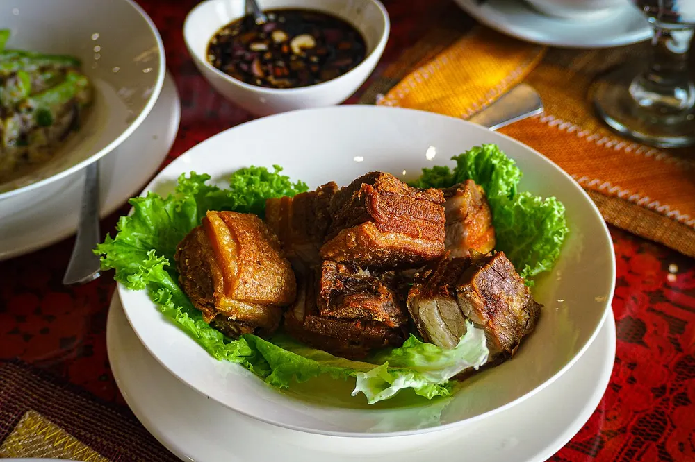 Lechon kawali — deep-fried crispy pork belly, served with dipping sauce