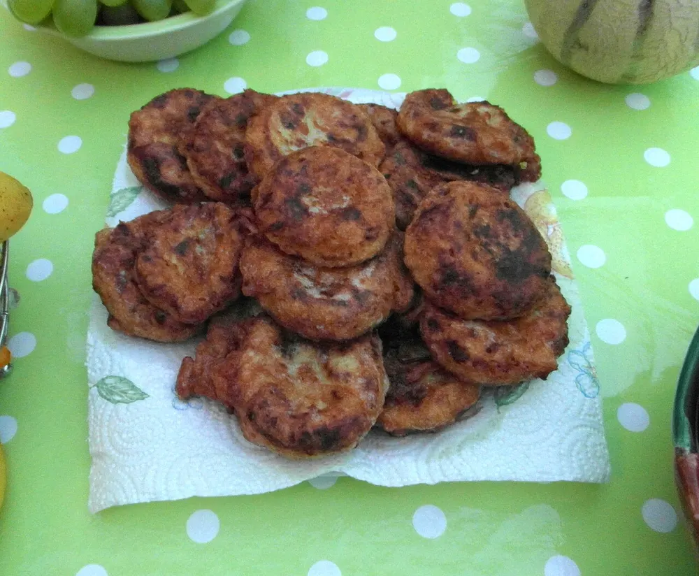 Golden fried Moroccan potato cakes draining on paper