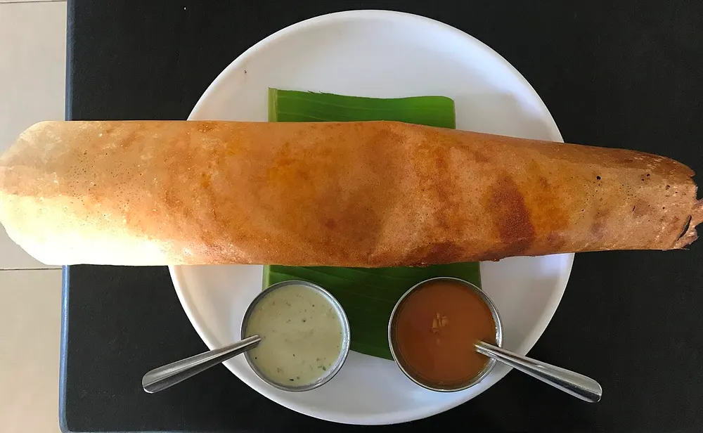 Masala dosa — crispy fermented rice crêpe with spiced potato, coconut chutney and sambar