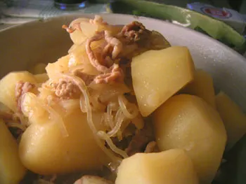 A bowl of nikujaga with beef, potato and carrot