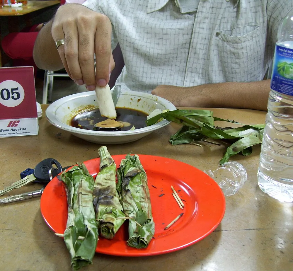Otak-otak — spiced fish paste grilled in banana or pandan leaves