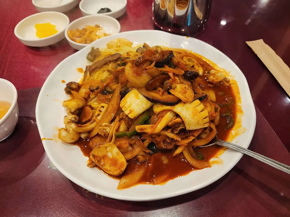 Bokkeum-udong — udon noodles stir-fried with seafood in a spicy sauce