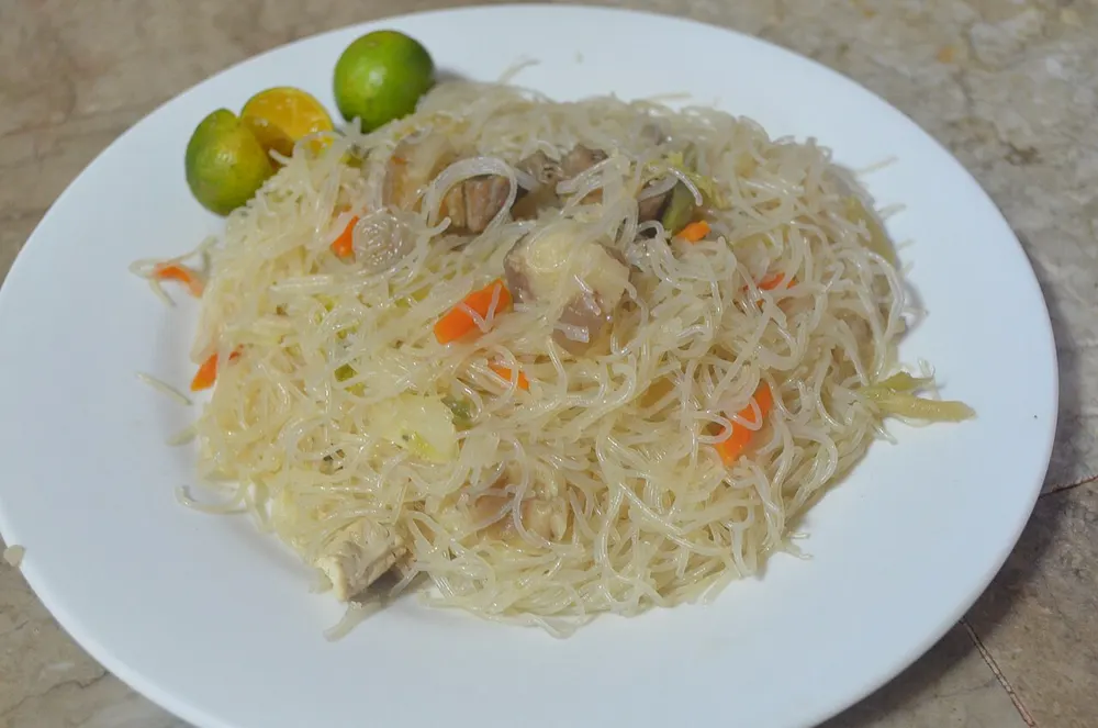 Pancit bihon guisado — thin rice vermicelli stir-fried with pork and vegetables