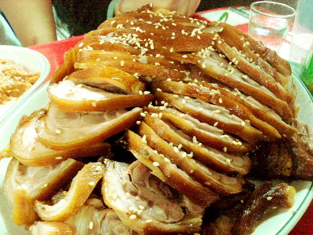 Sliced Korean jokbal braised pig's trotters on a plate