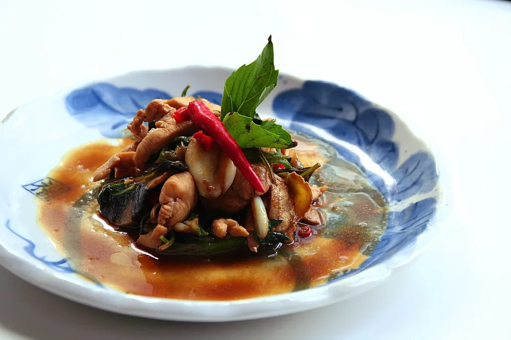 Sanbeiji — three-cup chicken braised with soy, sesame oil, rice wine and basil