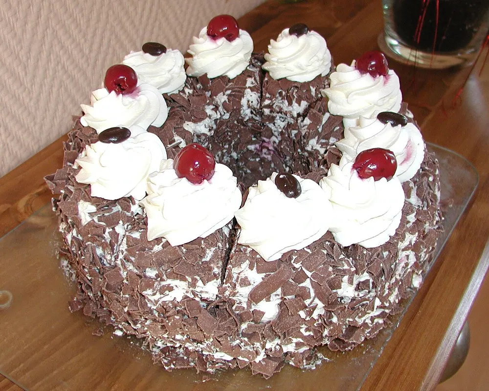 Schwarzwälder Kirschtorte — Black Forest cake with chocolate sponge, cherries and whipped cream