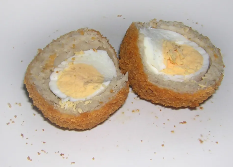 Scotch egg — a boiled egg wrapped in sausage meat and breadcrumbs, deep-fried