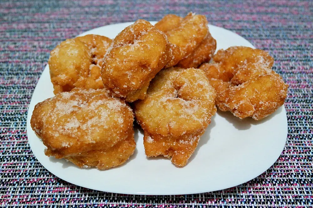 Sfenj — Moroccan fried dough rings dusted with sugar
