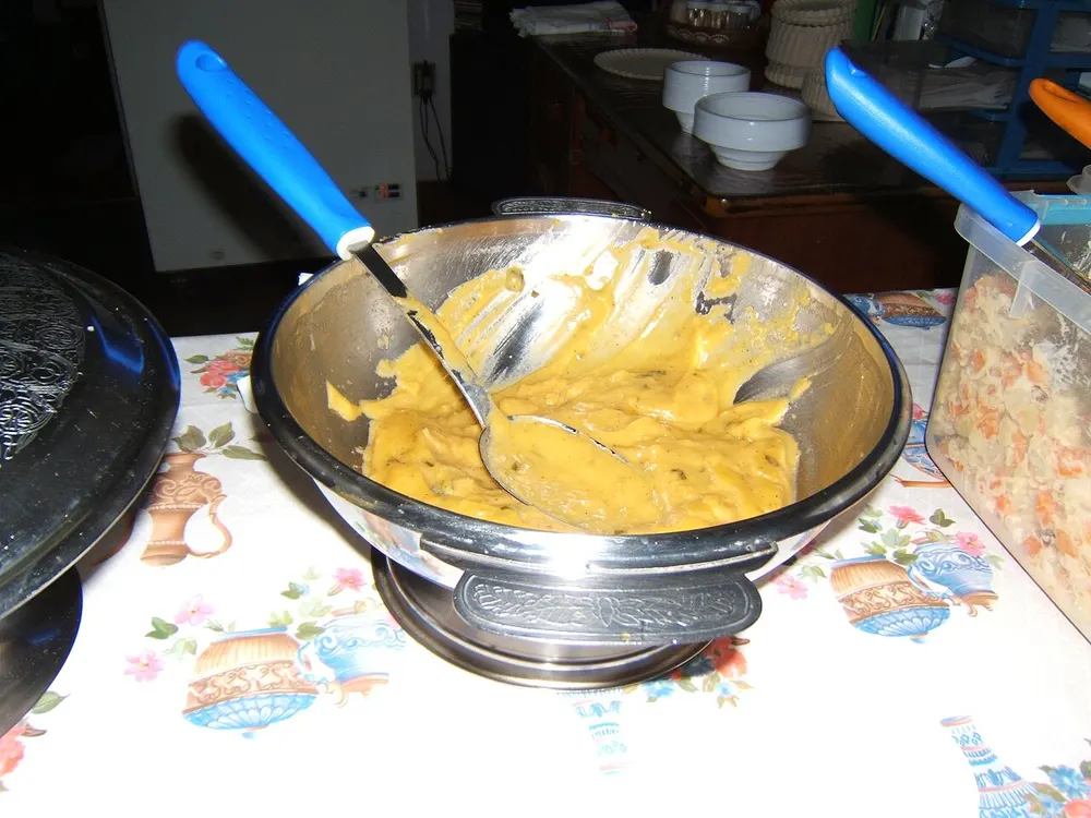 A bowl of creamy yellow shrimp-and-bread vatapá