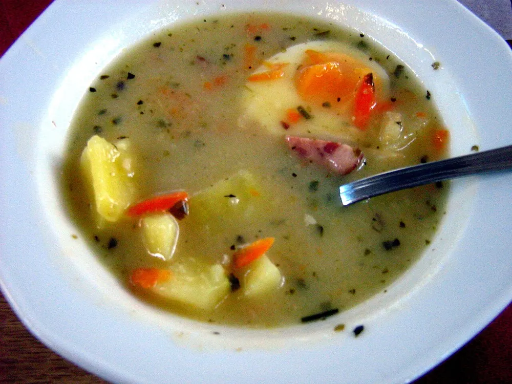 Żurek — sour rye soup with sausage, potato and a boiled egg